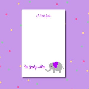 May include: A white notepad with the text "A Note from" in purple script. Below, the name "Dr. Joselyn Allen" is also in purple script. A gray elephant with a purple heart-shaped saddle is on the bottom right.