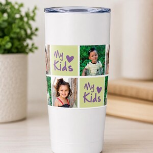 May include: A white cylindrical tumbler featuring a photo collage wrap. The design includes two light green square panels with the purple text "My Kids" and a heart icon, interspersed with photographs of children in various outdoor settings.