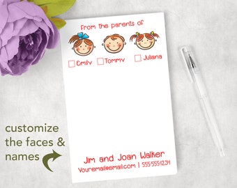 May include: A white notepad with red text and cartoon faces. The text reads "From the parents of" followed by three faces and names: Emily, Tommy, and Juliana. The bottom of the notepad has the names Jim and Joan Walker, an email address, and a phone number. A pen rests on the notepad.