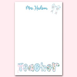 May include: White stationery with the name "Mrs. Hudson" in light blue script and a floral bow illustration. The word "Teacher" is written in a playful font with floral and striped patterns.