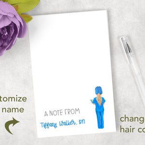 May include: A white notepad with a blue and white illustration of a nurse holding a clipboard. The text "A Note From" is printed on the notepad, followed by the name "Tiffany Walker, RN" written in blue ink.