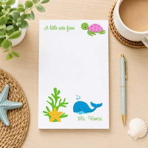 May include: A white rectangular notepad featuring the green text A little note from at the top, a pink and green turtle, a yellow starfish, green seaweed, a blue whale, and the green text Ms. Vance at the bottom of the page.