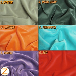May include: A display of six velvet fabric swatches in various colours: oyster, orange, purple, dark grey, turquoise, and red. The fabric appears soft and has a subtle sheen. The manufacturer's logo is also visible in the image.