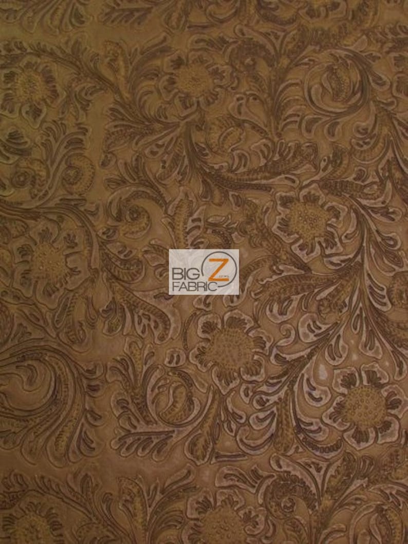 May include: Brown faux leather fabric with an embossed floral pattern. The fabric has a textured, raised design.