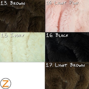 May include: Close-up of five different faux fur fabric swatches in brown, light pink, ivory, black, and light brown. The swatches are labeled with numbers 13 through 17.