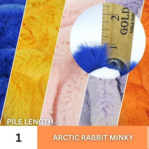 May include: Close-up of five different colors of faux fur fabric, each with a different pile length. The fabric is labeled "Arctic Rabbit Minky" and "Pile Length 1". A ruler is used to measure the pile length, which is 1 inch.