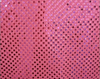 May include: Pink fabric with a pattern of small purple sequins in a diagonal pattern.