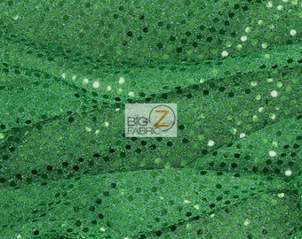 May include: Green sequin fabric with a shiny finish. The sequins are small and evenly spaced.
