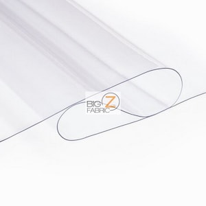 Peut inclure: Feuille de plastique transparente, enroul&eacute;e, avec le texte "BIG Z FABRIC" imprim&eacute; dessus.