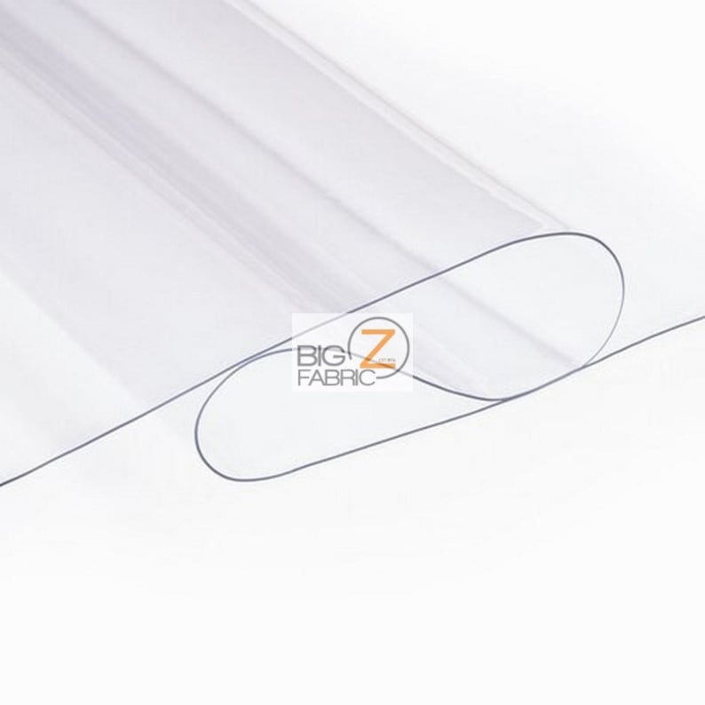 Peut inclure: Feuille de plastique transparente, enroul&eacute;e, avec le texte "BIG Z FABRIC" imprim&eacute; dessus.
