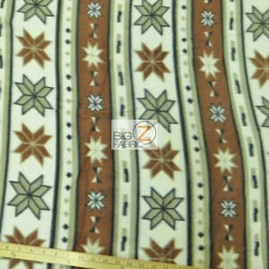 May include: White fleece fabric with a brown, beige, and black geometric pattern of stars and stripes. The fabric is measured with a ruler in inches.