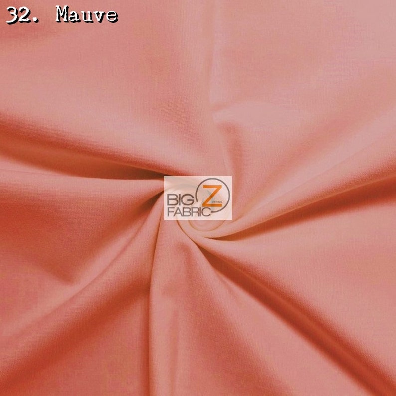 May include: A close-up of a soft, mauve-colored fabric. The fabric is smooth and has a slight sheen. The fabric is folded in a way that shows its texture. The text "32. Mauve" is visible in the top left corner of the image. The text "BIG Z FABRIC" is visible in the center of the image.