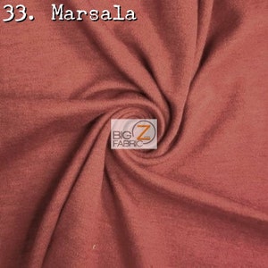 May include: A close-up of a soft, stretchy fabric in a rich, deep red-brown color called "Marsala". The fabric is folded and draped, showcasing its texture and drape. The image includes the text "33. Marsala" and a logo for "Big Z Fabric".
