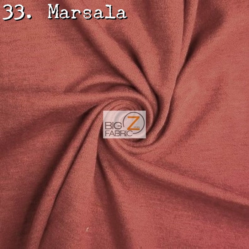 May include: A close-up of a soft, stretchy fabric in a rich, deep red-brown color called "Marsala". The fabric is folded and draped, showcasing its texture and drape. The image includes the text "33. Marsala" and a logo for "Big Z Fabric".