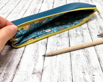 Estuche minimalista de piel sintética color verde azulado con cierre de cremallera, organizador de papelería