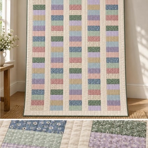 May include: A rectangular quilt featuring a vertical striped pattern of alternating cream-colored fabric columns and rows of small, multi-colored floral and gingham print fabric squares in shades of pink, green, blue, and lavender.