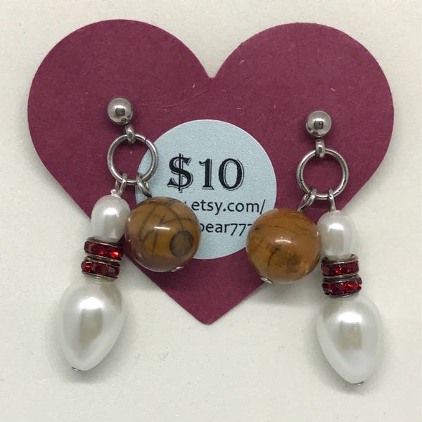 Bowling theme post earrings with brown earth-toned bowling balls and white glass beads for the pins