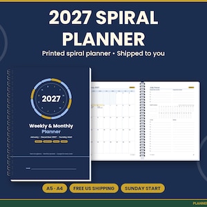 May include: A dark blue 2027 spiral planner with a circular graphic on the cover. The cover text reads 2027 Weekly & Monthly Planner January-December 2027 Sunday start. The open planner shows a monthly calendar grid and a July focus page.