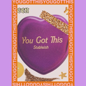 May include: Purple heart-shaped object with the text "You Got This" and "Stableish" in gold lettering. The background is a collage of gold glitter, a yellow star, and the phrase "You Got This" repeated in orange.