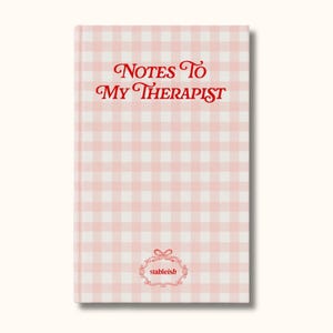 May include: A pink and white gingham-patterned notebook with the text "Notes To My Therapist" in red script. The notebook also features the "stableish" logo in a decorative frame.