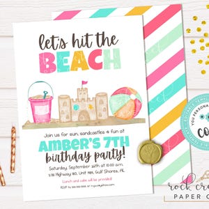 May include: A beach-themed invitation with the text "Let's hit the BEACH" in colorful letters. The invitation features illustrations of a sandcastle, beach ball, and a bucket. The text reads "Amber's 7th birthday party!"