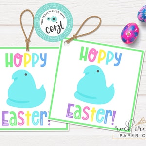 May include: Two printable gift tags with a green border. Each tag features a blue and white marshmallow-shaped character with the text "Hoppy Easter!" in rainbow colors.