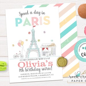 May include: A printable Paris-themed birthday party invitation with a pink, blue and yellow colour scheme. The invitation features a drawing of the Eiffel Tower, a bicycle and a cafe. The text on the invitation reads "Spend a day in Paris", "Olivia's 8th birthday soir&eacute;e!" and "Come celebrate with us at".