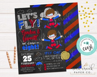 May include: A black chalkboard style invitation with red, blue, and white text. It says "Let's Fly! Landon & Garrett are leaping to eight!" with a skydiving cartoon character. The invitation is for a birthday party on February 25th from 2:00-4:00 PM. It includes the address and RSVP information.