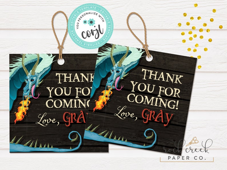 May include: Two blue and green dragon favour tags with a woodgrain background. The text on the tags reads "Thank you for coming! Love, Gray".