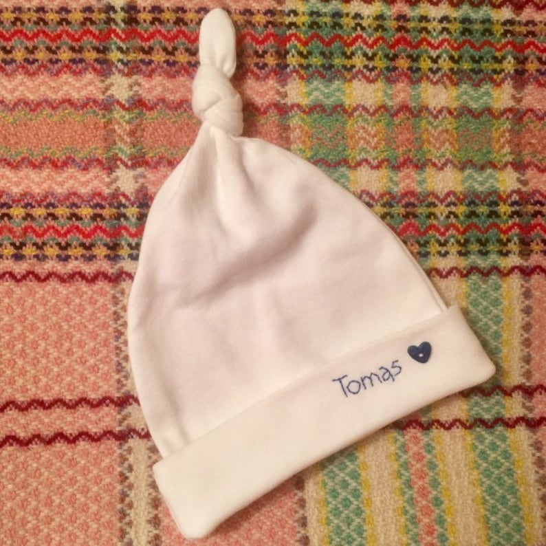 white cotton newborn hat