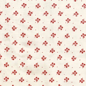 May include: Off-white fabric featuring a repeating pattern of small, dark red floral sprigs and dots. The sprigs are clustered, creating a delicate, vintage aesthetic. The fabric appears to be cotton or a similar material.