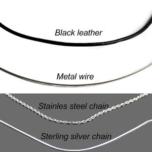 May include: A selection of necklace materials against a gray background. The options include a black leather cord, a metal wire, a stainless steel chain, and a sterling silver chain. Text labels identify each material.