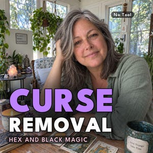 May include: A person with shoulder-length graying hair wearing a sage green shirt. Large purple text reads CURSE REMOVAL, with smaller text reading HEX AND BLACK MAGIC. Tarot cards are spread on a wooden table in front of the person.