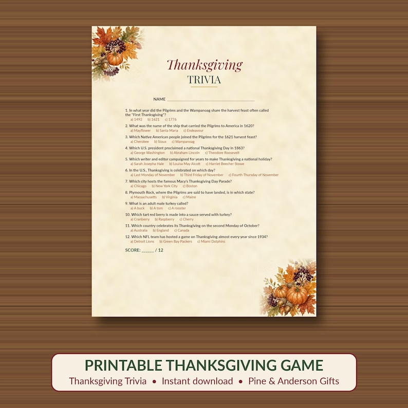 May include: A Thanksgiving trivia game sheet on cream-colored paper with a decorative border of autumn leaves, acorns, and pumpkins in the top-left and bottom-right corners. The text includes twelve multiple-choice questions and a score line.