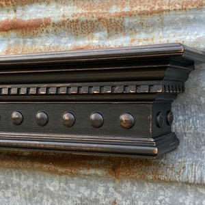 Black Wooden Wall Shelf Mantel with Dentil Crown Molding and Wooden Domes