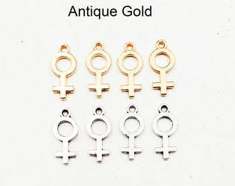 Puede incluir: Ocho abalorios de metal en forma de símbolo femenino. Cuatro abalorios son de oro antiguo y cuatro abalorios son de plata antigua.