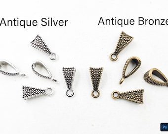 May include: A collection of triangular pendant bails featuring a textured, beaded surface. The set includes four pieces in an antique silver finish and four pieces in an antique bronze finish, each with a small circular loop for attachment.