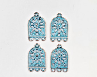 May include: Four turquoise blue metal charms with a decorative floral design and three loops at the bottom. The charms are in the shape of an arch.