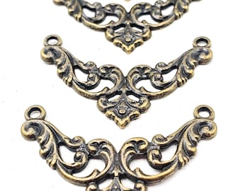May include: Four antique bronze-colored filigree embellishments. Each piece has a curved, symmetrical design with ornate scrollwork and a small loop at each end for attachment. The pieces are arranged on a white background.