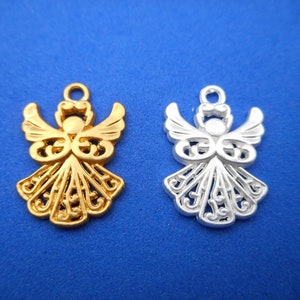 May include: Two angel charms, one gold and one silver, with intricate filigree designs. The charms are perfect for adding a touch of elegance to jewelry or crafts.