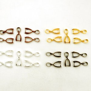 May include: Assortment of 20 jump rings in four different colors: bronze, gold, silver, and black. Each jump ring is approximately 1.5 cm long.