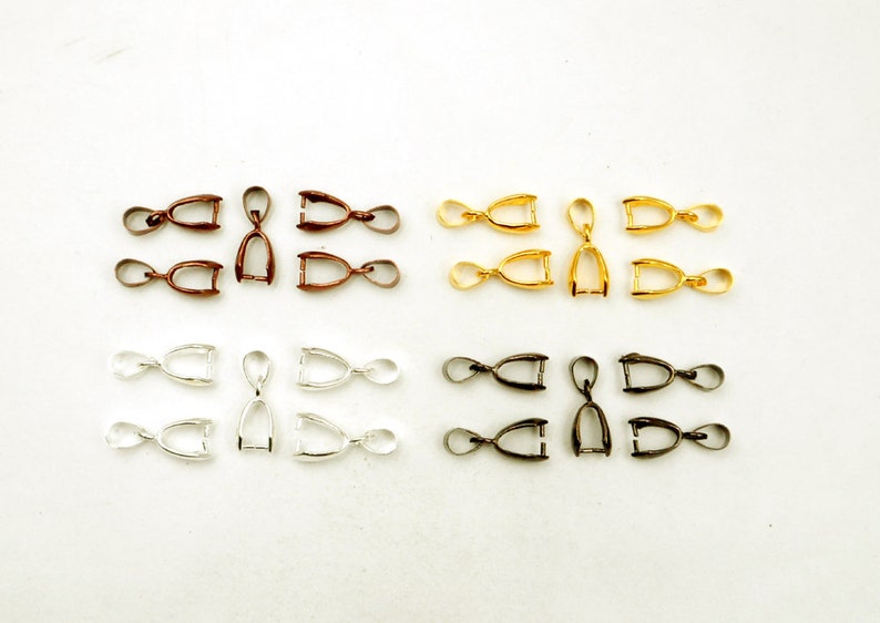 May include: Assortment of 20 jump rings in four different colors: bronze, gold, silver, and black. Each jump ring is approximately 1.5 cm long.