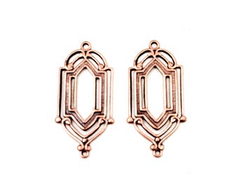 May include: Two identical copper-toned metal jewelry connectors featuring an elongated, open-frame geometric design. Each piece has a central hexagonal cutout, curved scrollwork accents at the top and bottom, and small circular loops for attachment.