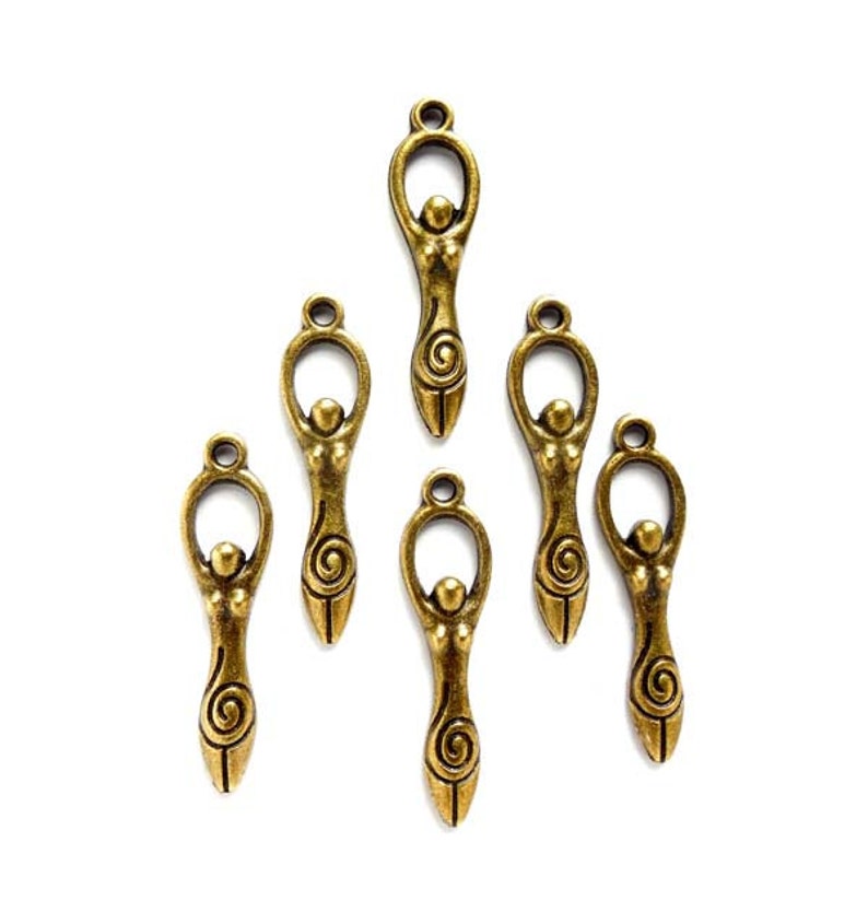 May include: Seven antique gold-toned metal charms featuring a stylized female figure with a spiral design. The charms are perfect for jewelry making or crafting.