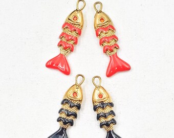 May include: Four fish-shaped charms. Two are red with gold accents and two are black with gold accents. The charms have a loop at the top for hanging and the word "Red" and "Black" are printed on the image.