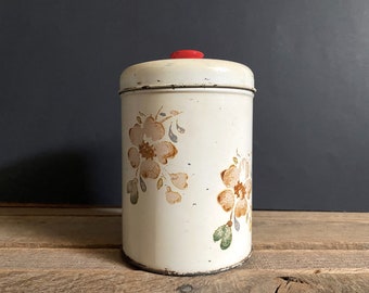 Vintage 5-1/2" Tall Cream Colored & Floral  Metal Canister w/ Plastic Red Knob - Unmarked