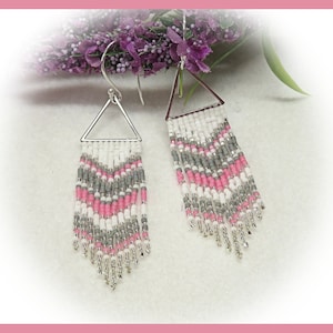 May include: A pair of silver triangle dangle earrings with pink, white, and gray beaded fringe.