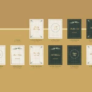 May include: A collection of twelve rectangular greeting cards arranged in two rows against a solid gold background. The cards feature cream or dark green backgrounds with gold foil text and decorative borders, displaying phrases like Happy Birthday, Well Aged, Another Lap, Celebrate, Make a Wish, Best Wishes, You Are Loved, Still Fabulous, Happy Day, and With Love.