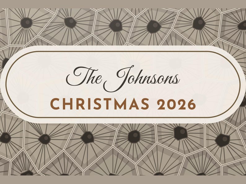 May include: A rectangular sign with rounded corners featuring a cream-colored center panel with the text The Johnsons CHRISTMAS 2026 in black and brown. The background displays a repeating pattern of gray geometric shapes with dark centers.