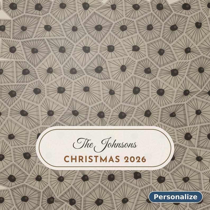 May include: A rectangular sign featuring a beige background with a repeating pattern of gray geometric cells, each containing a dark center dot. A central white label displays the text The Johnsons CHRISTMAS 2026. A small blue button says Personalize.